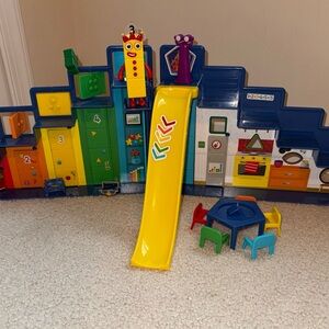 Vibrant Playset with Yellow Slide and Figures